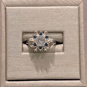 AVON silver ring with blue and white stones, never worn.